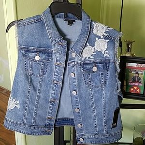 Adorable jean vest with floral accents